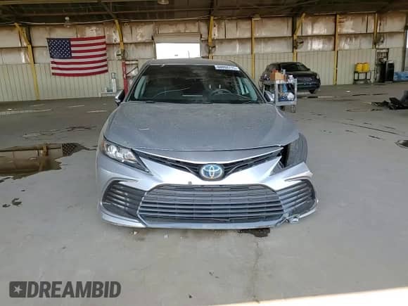 2021 Toyota Camry Hybrid LE with VIN 4T1C31AK5MU554381, listed as a Copart auction lot 69998775 with 104,313 mi miles and Salvage title. Bid and sale history available at DreamBid. Image 13.