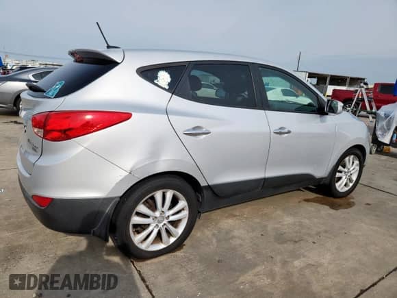 2013 Hyundai Tucson GLS with VIN KM8JU3AC7DU566198, listed as a Copart auction lot 71479605 with 196,474 mi miles and Salvage title. Bid and sale history available at DreamBid. Image 3.