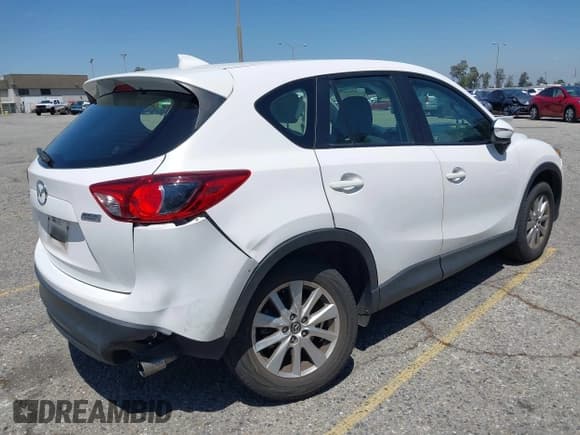✅ 2016 Mazda CX-5 Sport • VIN: JM3KE2BY5G0793032 • Lot: 42128706. Listed on IAAI with 52,010 mi. Free auction sales archive from the USA and detailed vehicle history report at DreamBid. Image 4.