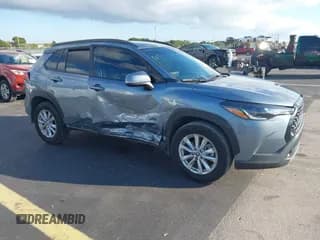 ✅ 2023 Toyota Corolla Cross LE • VIN: 7MUCAAAG7PV064903 • Lot: 43584375. Listed on IAAI with 28,011 mi. Free auction sales archive from the USA and detailed vehicle history report at DreamBid. Image 1.