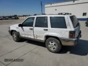 ✅ 1994 Jeep Grand Cherokee Laredo • VIN: 1J4GZ58S6RC310800 • Лот: 64095725. Опубликован ранее на Copart с пробегом 241 876 миль. Бесплатный доступ к архиву аукционных продаж из США и подробный отчёт об истории автомобиля на DreamBid. Изображение 2.