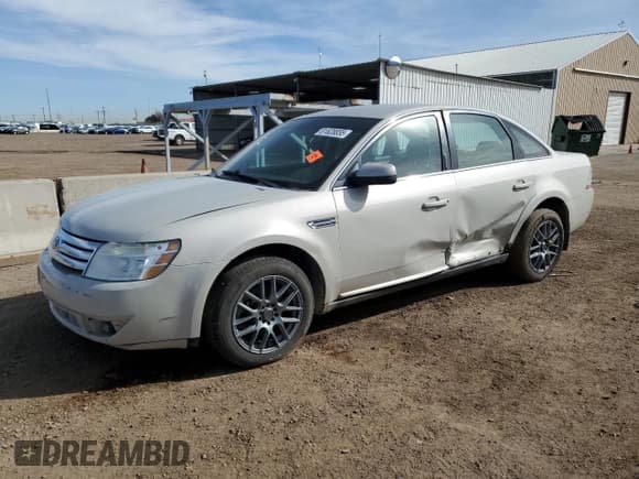 ✅ 2008 Ford Taurus SEL • VIN: 1FAHP24W58G123049 • Lot: 81828855. Listed on Copart with 206,906 mi. Free auction sales archive from the USA and detailed vehicle history report at DreamBid. Image 1.