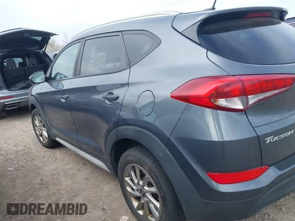 2017 Hyundai Tucson SE z VIN KM8J33A42HU527276, wystawiony jako IAAI lot #43456757 z przebiegiem 153 884 mil mil oraz . Historia ofert i sprzedaży dostępna na DreamBid. Obrazek 14.