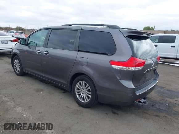 2011 Toyota Sienna XLE AAS with VIN 5TDYK3DC8BS059333, listed as a IAAI auction lot 43501915 with 173,775 mi miles and . Bid and sale history available at DreamBid. Image 3.
