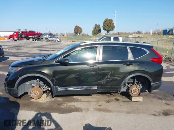 ✅ 2018 Honda CR-V Touring • VIN: 7FARW2H90JE052921 • Lot: 43671364. Listed on IAAI with 101,261 mi. Free auction sales archive from the USA and detailed vehicle history report at DreamBid. Image 13.