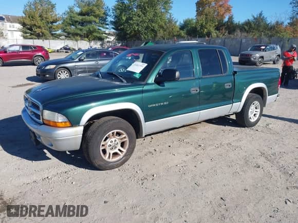 2002 Dodge Dakota SLT z VIN 1B7HL48N82S625237, wystawiony jako IAAI lot #43483399 z przebiegiem 183 405 mil mil oraz . Historia ofert i sprzedaży dostępna na DreamBid. Obrazek 2.
