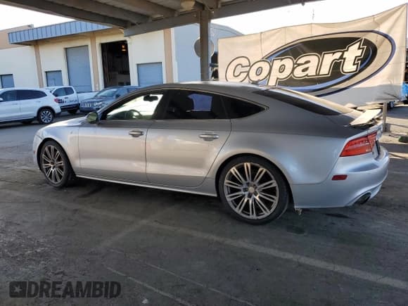 ✅ 2014 Audi A7 Premium Plus • VIN: WAUWGAFC6EN027711 • Лот: 85944305. Опубликован ранее на Copart с пробегом 179 298 миль. Бесплатный доступ к архиву аукционных продаж из США и подробный отчёт об истории автомобиля на DreamBid. Изображение 2.