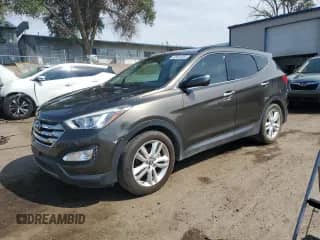 2013 Hyundai Santa Fe Sport z VIN 5XYZU3LA5DG103867, wystawiony jako Copart lot #68504365 z przebiegiem 100 570 mil mil oraz Szkoda całkowita • Salvage title. Historia ofert i sprzedaży dostępna na DreamBid. Obrazek 1.