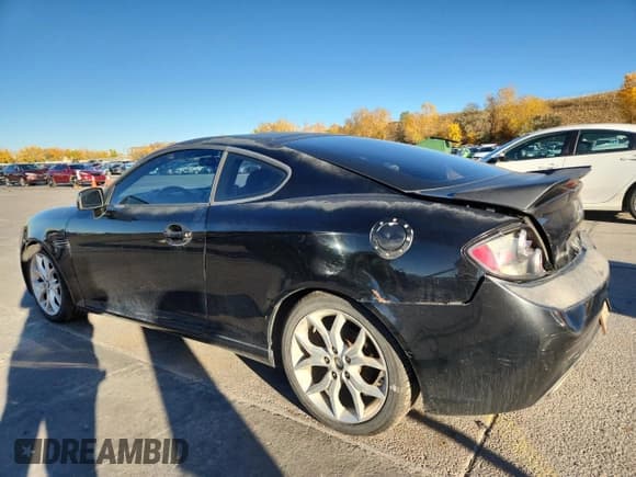 ✅ 2007 Hyundai Tiburon GT • VIN: KMHHN66F37U245828 • Лот: 85207915. Опубликован ранее на Copart с пробегом 126 850 миль. Бесплатный доступ к архиву аукционных продаж из США и подробный отчёт об истории автомобиля на DreamBid. Изображение 2.