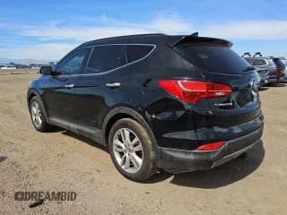 ✅ 2014 Hyundai Santa Fe • VIN: 5XYZUDLAXEG200294 • Лот: 69449845. Опубликован ранее на Copart с пробегом 128 035 миль. Бесплатный доступ к архиву аукционных продаж из США и подробный отчёт об истории автомобиля на DreamBid. Изображение 2.