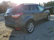 ✅ 2018 Ford Escape SE • VIN: 1FMCU0GD7JUC27721 • Lot: 93012415. Listed on Copart with 144,625 mi. Free auction sales archive from the USA and detailed vehicle history report at DreamBid. Image 3.