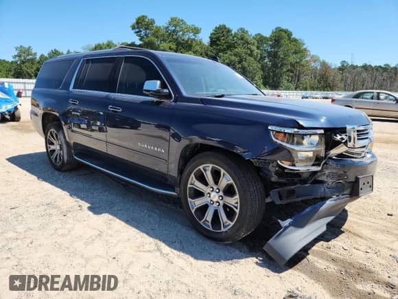 2019 Chevrolet Suburban Premier with VIN 1GNSCJKCXKR110511, listed as a Copart auction lot 71028945 with 87,669 mi miles and Salvage title. Bid and sale history available at DreamBid. Image 4.