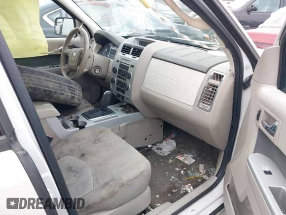 2010 Mercury Mariner z VIN 4M2CN8B70AKJ11932, wystawiony jako IAAI lot #40980162 z przebiegiem Nie podano mil oraz . Historia ofert i sprzedaży dostępna na DreamBid. Obrazek 5.