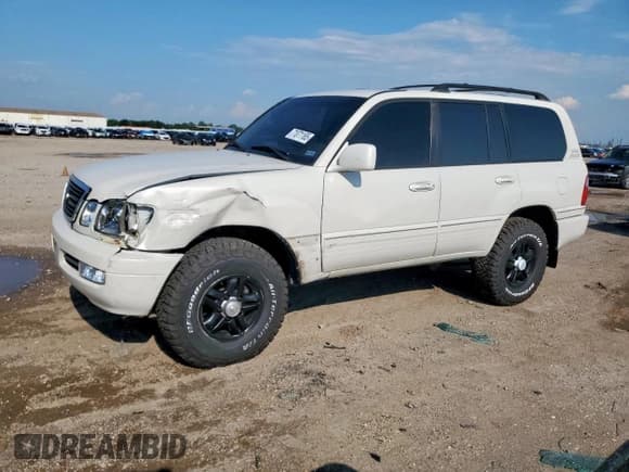 ✅ 2002 Lexus LX 470 • VIN: JTJHT00W923514541 • Lot: 71071165. Listed on Copart with 307,071 mi. Free auction sales archive from the USA and detailed vehicle history report at DreamBid. Image 1.