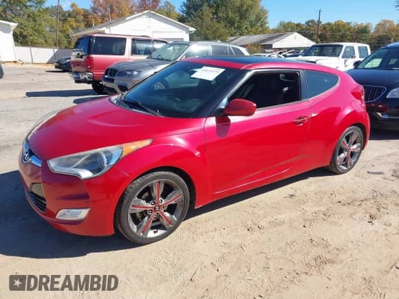 2016 Hyundai Veloster z VIN KMHTC6AD9GU282761, wystawiony jako IAAI lot #43624975 z przebiegiem 126 546 mil mil oraz . Historia ofert i sprzedaży dostępna na DreamBid. Obrazek 2.