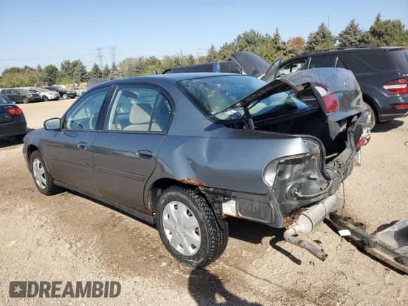 2003 Chevrolet Malibu with VIN 1G1ND52J83M648169, listed as a Copart auction lot 74711844 with 156,544 mi miles and Salvage title. Bid and sale history available at DreamBid. Image 2.