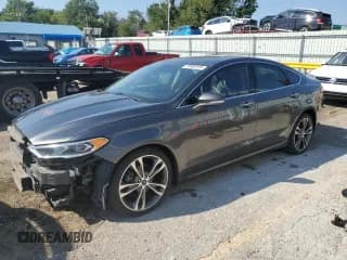 ✅ 2020 Ford Fusion Titanium • VIN: 3FA6P0D9XLR118047 • Lot: 70889105. Listed on Copart with 84,525 mi. Free auction sales archive from the USA and detailed vehicle history report at DreamBid. Image 1.