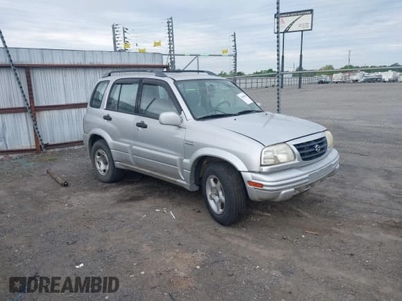 ✅ 2000 Suzuki Grand Vitara JLX • VIN: JS3TD62V5Y4117740 • Lot: 42088696. Listed on IAAI with 166,484 mi. Free auction sales archive from the USA and detailed vehicle history report at DreamBid. Image 1.
