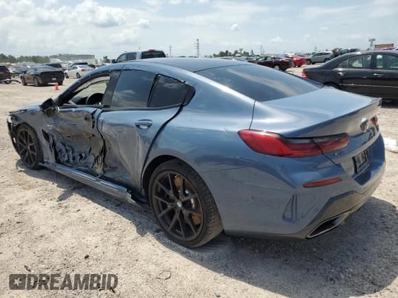 ✅ 2022 BMW 8 Series M850i • VIN: WBAGV8C05NCH25299 • Lot: 57378503. Listed on Copart with Not provided. Free auction sales archive from the USA and detailed vehicle history report at DreamBid. Image 2.