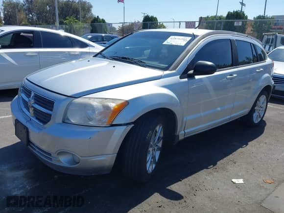 2012 Dodge Caliber SXT Plus with VIN 1C3CDWEA1CD532493, listed as a IAAI auction lot 42876205 with 103,280 mi miles and . Bid and sale history available at DreamBid. Image 2.