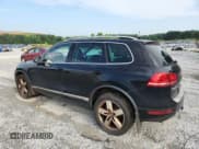 ✅ 2013 Volkswagen Touareg Lux • VIN: WVGEF9BP6DD010352 • Lot: 62585305. Listed on Copart with 210,935 mi. Free auction sales archive from the USA and detailed vehicle history report at DreamBid. Image 2.