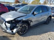 ✅ 2016 Mazda CX-5 Grand Touring • VIN: JM3KE2DY8G0604998 • Lot: 43696169. Listed on IAAI with 104,349 mi. Free auction sales archive from the USA and detailed vehicle history report at DreamBid. Image 2.