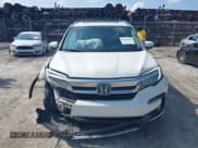 ✅ 2019 Honda Pilot Touring 8-Passenger • VIN: 5FNYF5H9XKB001842 • Lot: 43026784. Listed on IAAI with 114,674 mi. Free auction sales archive from the USA and detailed vehicle history report at DreamBid. Image 13.