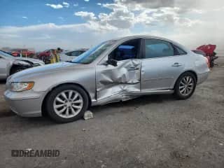 2007 Hyundai Azera SE z VIN KMHFC46FX7A155031, wystawiony jako Copart lot #80005625 z przebiegiem 137 076 mil mil oraz Szkoda całkowita • Salvage title. Historia ofert i sprzedaży dostępna na DreamBid. Obrazek 1.