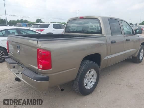 2006 Dodge Dakota SLT with VIN 1D7HE48N16S703072, listed as a IAAI auction lot 42156709 with 102,919 mi miles and . Bid and sale history available at DreamBid. Image 4.