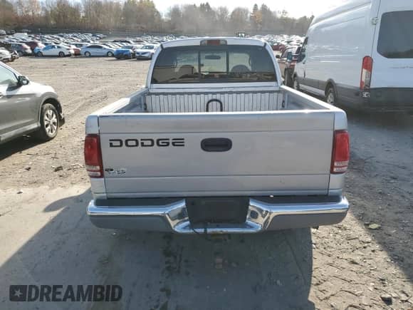 2004 Dodge Dakota SLT z VIN 1D7HL48K24S721847, wystawiony jako Copart lot #77673774 z przebiegiem Nie podano mil oraz Szkoda całkowita • Salvage title. Historia ofert i sprzedaży dostępna na DreamBid. Obrazek 6.