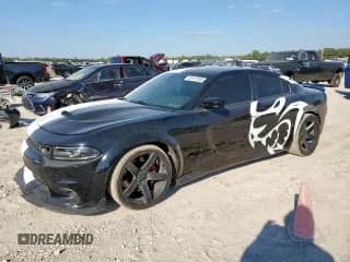 ✅ 2018 Dodge Charger • VIN: 0K0740032512 • Lot: 85167555. Listed on Copart with 56,499 mi. Free auction sales archive from the USA and detailed vehicle history report at DreamBid. Image 1.
