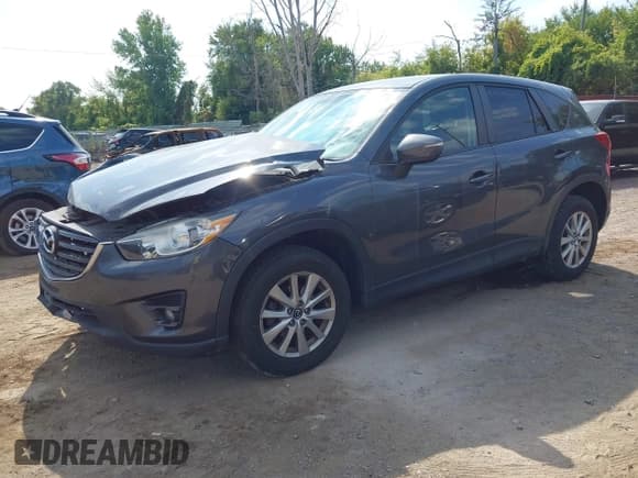 ✅ 2016 Mazda CX-5 Touring • VIN: JM3KE4CY3G0661445 • Лот: 43248250. Опубликован ранее на IAAI с пробегом 111 403 миль. Бесплатный доступ к архиву аукционных продаж из США и подробный отчёт об истории автомобиля на DreamBid. Изображение 2.