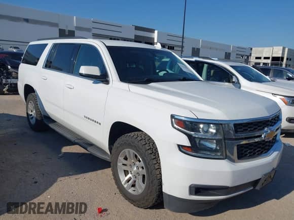 2018 Chevrolet Suburban LS z VIN 1GNSKGKC1JR137052, wystawiony jako IAAI lot #42942872 z przebiegiem 150 898 mil mil oraz . Historia ofert i sprzedaży dostępna na DreamBid. Obrazek 1.