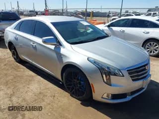 ✅ 2019 Cadillac XTS Luxury • VIN: 2G61M5S33K9154002 • Лот: 43489746. Опубликован ранее на IAAI с пробегом 116 363 миль. Бесплатный доступ к архиву аукционных продаж из США и подробный отчёт об истории автомобиля на DreamBid. Изображение 1.