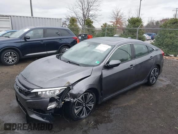 ✅ 2018 Honda Civic EX-T • VIN: JHMFC1F34JX029310 • Lot: 43770255. Listed on IAAI with 71,655 mi. Free auction sales archive from the USA and detailed vehicle history report at DreamBid. Image 2.
