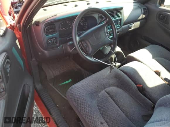 1999 Dodge Dakota SLT z VIN 1B7GL22X1XS249532, wystawiony jako Copart lot #56391484 z przebiegiem 154 117 mil mil oraz Szkoda całkowita • Salvage title. Historia ofert i sprzedaży dostępna na DreamBid. Obrazek 8.