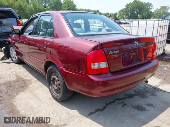 ✅ 2002 Mazda Protege DX • VIN: JM1BJ225421632202 • Lot: 42929238. Wystawiony na IAAI z przebiegiem 81 342 mil. Bezpłatny archiwum sprzedaży aukcyjnych z USA i szczegółowy raport historii pojazdu na DreamBid. Zdjęcie 3.