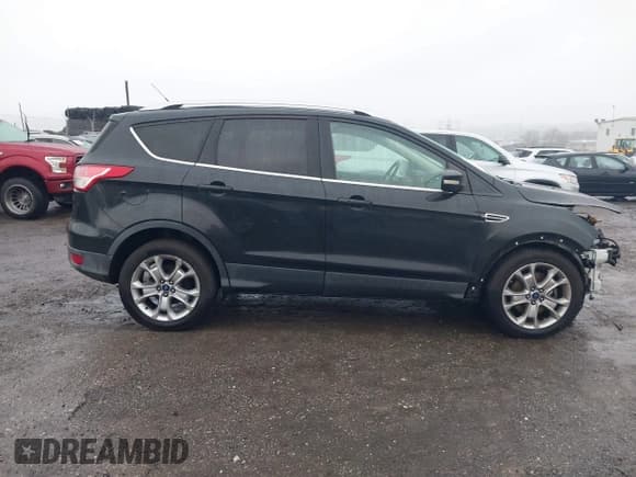 ✅ 2015 Ford Escape Titanium • VIN: 1FMCU9J9XFUB77087 • Lot: 43771373. Listed on IAAI with 95,650 mi. Free auction sales archive from the USA and detailed vehicle history report at DreamBid. Image 13.