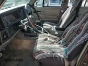 ✅ 1991 Jeep Cherokee • VIN: 1J4FJ88S0ML569019 • Lot: 85327315. Wystawiony na Copart z przebiegiem 189 038 mil. Bezpłatny archiwum sprzedaży aukcyjnych z USA i szczegółowy raport historii pojazdu na DreamBid. Zdjęcie 7.