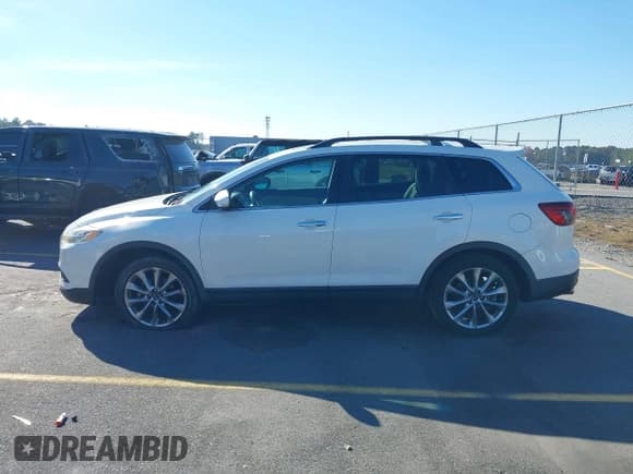 ✅ 2015 Mazda CX-9 Grand Touring • VIN: JM3TB2DA1F0448821 • Lot: 43612528. Wystawiony na IAAI z przebiegiem 173 000 mil. Bezpłatny archiwum sprzedaży aukcyjnych z USA i szczegółowy raport historii pojazdu na DreamBid. Zdjęcie 14.