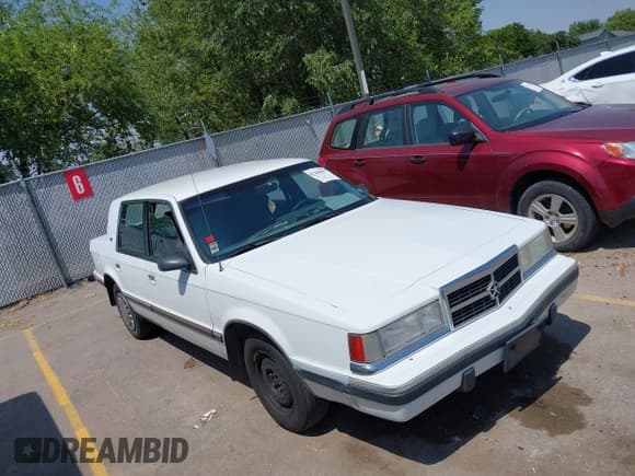 ✅ 1992 Dodge Dynasty LE • VIN: 1B3XC56RXND723509 • Lot: 42769093. Listed on IAAI with 99,589 mi. Free auction sales archive from the USA and detailed vehicle history report at DreamBid. Image 1.