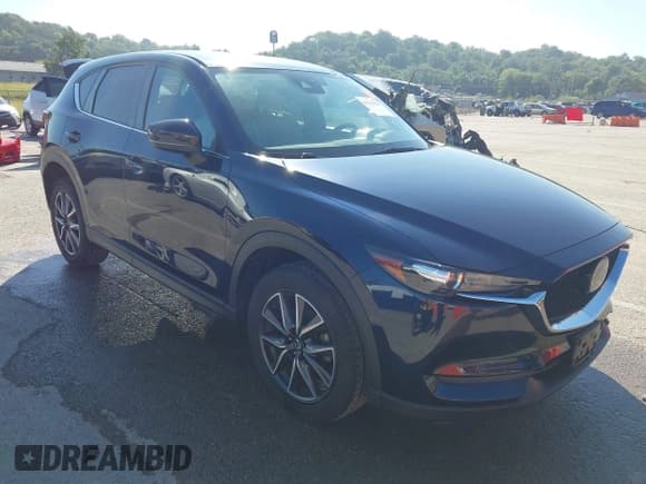 ✅ 2018 Mazda CX-5 Touring • VIN: JM3KFACM5J1473522 • Lot: 43315278. Listed on IAAI with 56,327 mi. Free auction sales archive from the USA and detailed vehicle history report at DreamBid. Image 1.