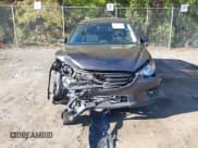 ✅ 2016 Mazda CX-5 Touring • VIN: JM3KE4CY5G0716056 • Lot: 43521281. Listed on IAAI with 107,968 mi. Free auction sales archive from the USA and detailed vehicle history report at DreamBid. Image 12.