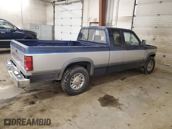 1991 Dodge Dakota z VIN 1B7GL23Y2MS258470, wystawiony jako Copart lot #45487985 z przebiegiem 176 958 mil mil oraz Szkoda całkowita • Salvage title. Historia ofert i sprzedaży dostępna na DreamBid. Obrazek 3.
