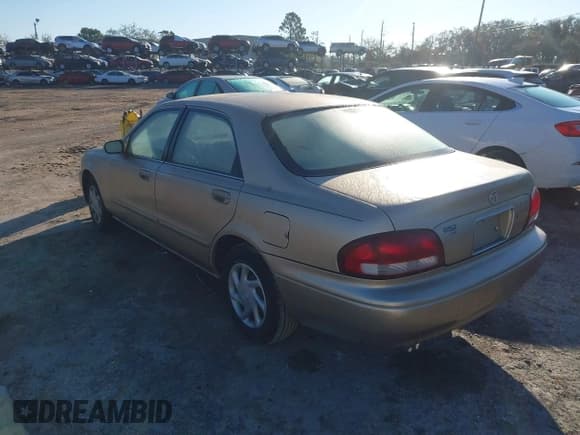 ✅ 1999 Mazda 626 ES • VIN: 1YVGF22C9X5825624 • Lot: 41646083. Listed on IAAI with 133,591 mi. Free auction sales archive from the USA and detailed vehicle history report at DreamBid. Image 3.