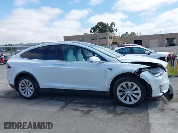 ✅ 2021 Tesla Model X Long Range Plus • VIN: 5YJXCDE27MF322200 • Lot: 42360282. Listed on IAAI with 37,072 mi. Free auction sales archive from the USA and detailed vehicle history report at DreamBid. Image 13.