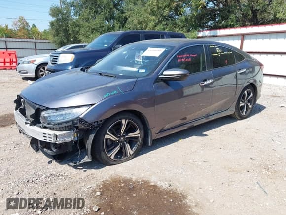 ✅ 2016 Honda Civic Touring • VIN: 19XFC1F90GE031070 • Lot: 43318105. Listed on IAAI with 55,853 mi. Free auction sales archive from the USA and detailed vehicle history report at DreamBid. Image 2.
