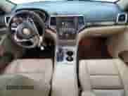 2018 Jeep Grand Cherokee Sterling with VIN 1C4RJFBG2JC204512, listed as a Copart auction lot 71598075 with 165,272 mi miles and Salvage title. Bid and sale history available at DreamBid. Image 8.