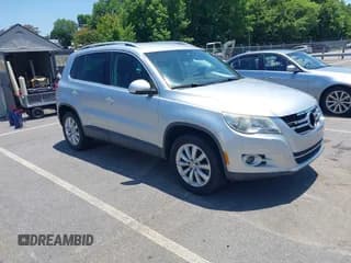 ✅ 2011 Volkswagen Tiguan S • VIN: WVGAV7AXXBW511253 • Lot: 42569188. Listed on IAAI with 154,229 mi. Free auction sales archive from the USA and detailed vehicle history report at DreamBid. Image 1.