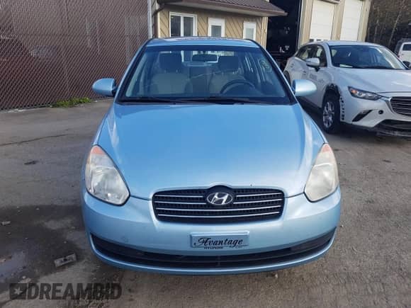 2007 Hyundai Accent GL z VIN KMHCN45C97U146808, wystawiony jako Copart lot #70781004 z przebiegiem Nie podano mil oraz Szkoda całkowita • Salvage title. Historia ofert i sprzedaży dostępna na DreamBid. Obrazek 5.